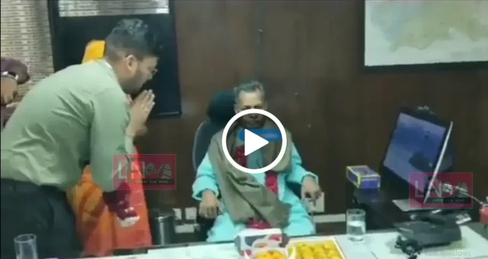 ias officer bows infront of a priest at his office and offer his official chair for him