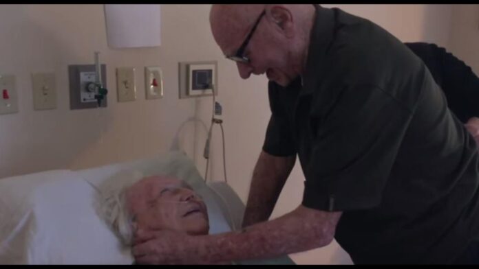 old man singing song for his dying wife