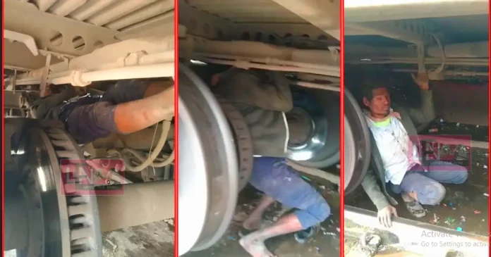 mp man hangs under a traina nd travels 290 km police started enquiry